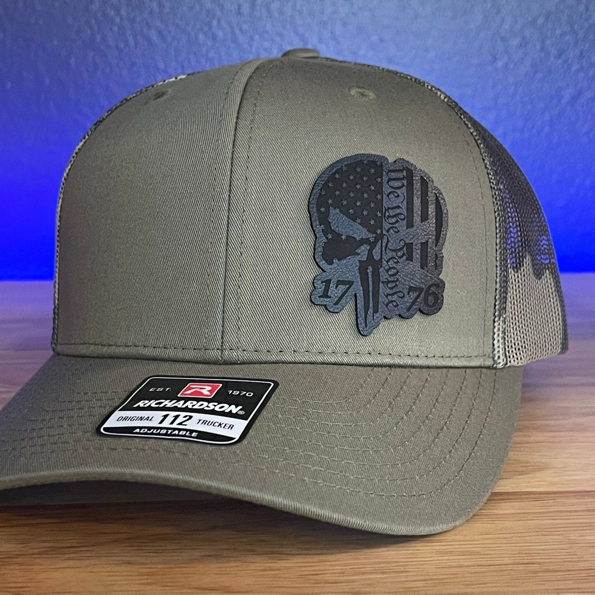 PUNISHER SKULL 1776 WE THE PEOPLE Black Side Leather Patch Hat Green/Camo Patch Hat